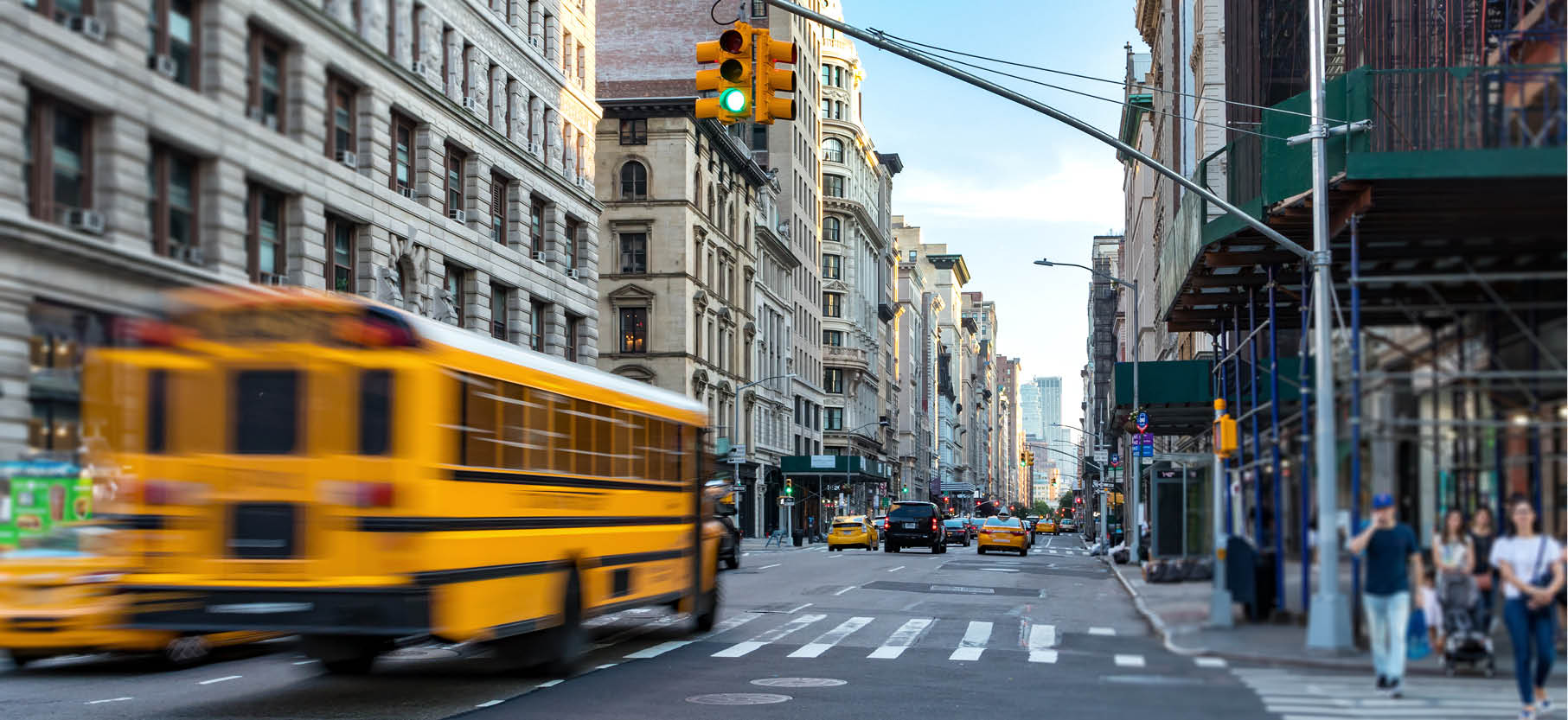 A school bus drives through NYC